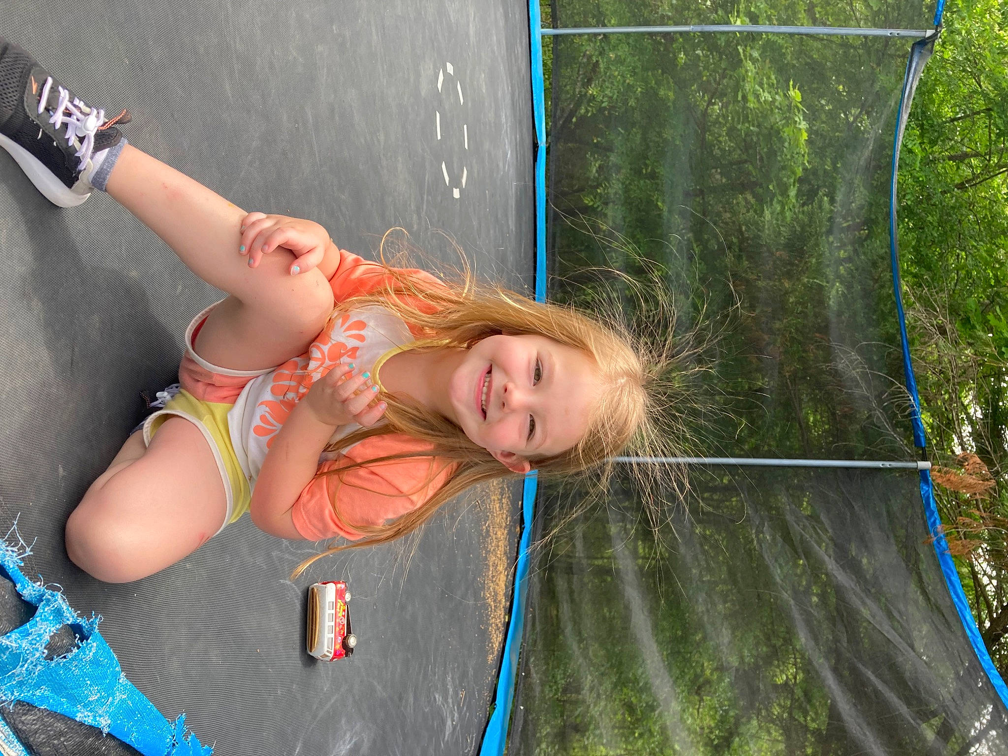 Kimberly is registered to the contest to win money with this photo: adventure, blond, child, fun, grass, happy, human_leg, jewellery, joy, leisure, long_hair, net, people_in_nature, person, plant, recreation, rope, smile, t_shirt, thigh
