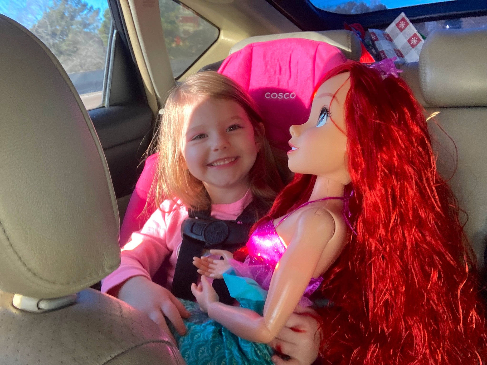 Kimberly is registered to the contest to win money with this photo: automotive_design, automotive_exterior, car, car_seat, car_seat_cover, child, fun, hair, happy, head_restraint, joy, leisure, magenta, motor_vehicle, people, person, pink, smile, summer, tree