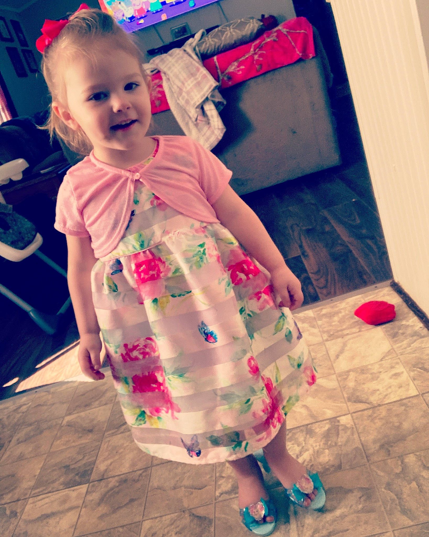 Kimberly is registered to the contest to win money with this photo: baby, baby_toddler_clothing, child, cool, dress, flooring, fun, hairstyle, happy, joy, magenta, one_piece_garment, person, pink, purple, red, skin, sleeve, smile, standing
