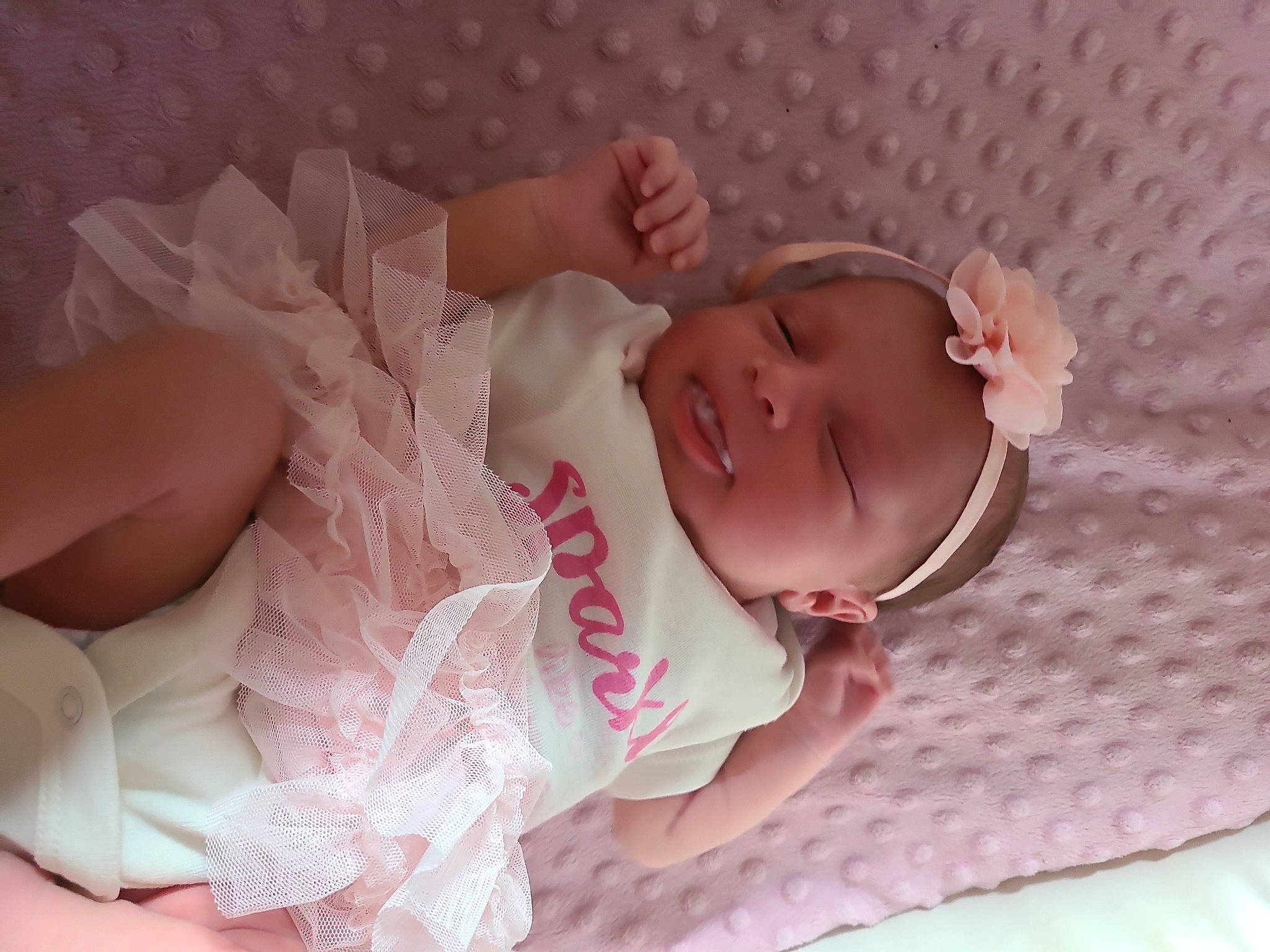 Victoria is registered to the contest to win money with this photo: arm, baby, baby_products, baby_toddler_clothing, cheek, child, comfort, eye, face, head, headgear, human_body, iris, lip, mouth, person, pink, skin, sleeve, textile