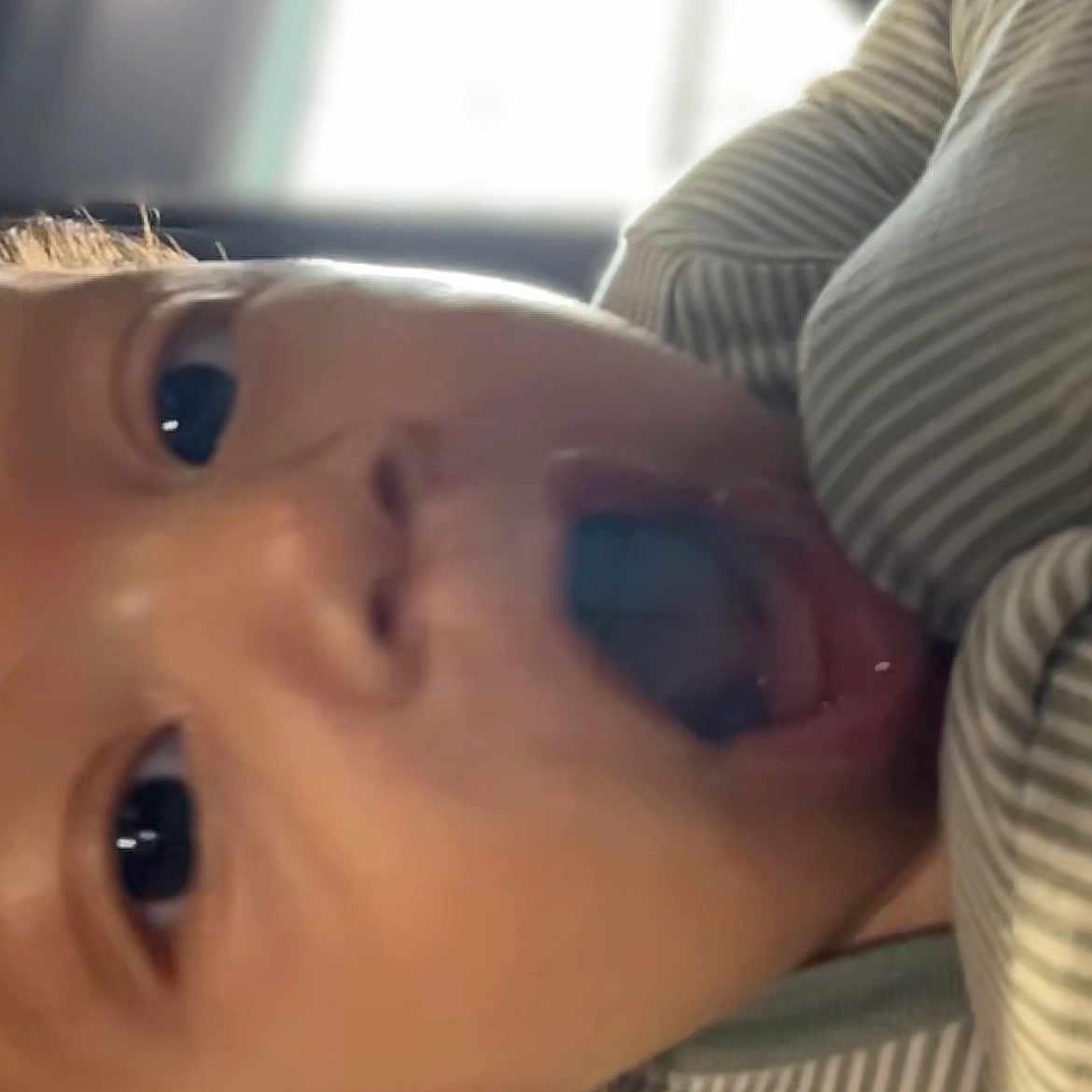 Wadih joined the competition — help win amazing prizes! baby, child, close_up, cute, emotion, expression, face, happy, head, indoors, infant, mouth_open, person, portrait, skin, soft_lighting, striped_clothing, surprised, wide_eyes, young_child