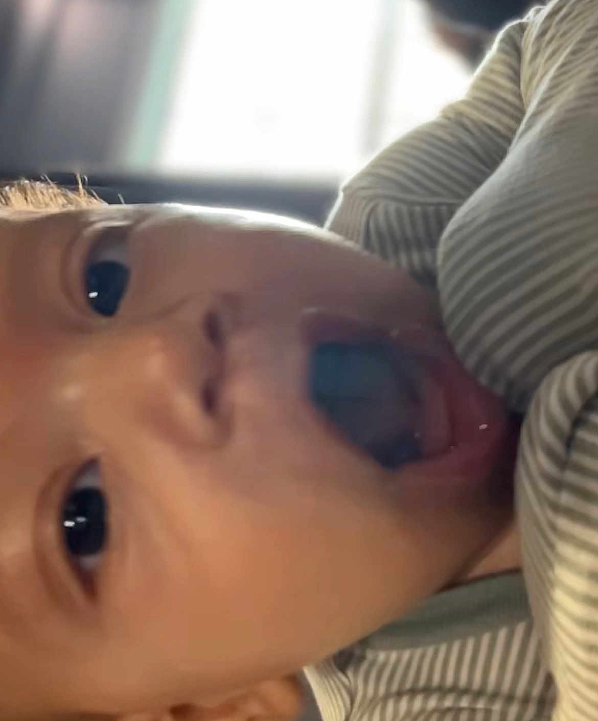 Wadih joined the competition — help win amazing prizes! baby, close_up, face, mouth_open, wide_eyes, striped_clothing, expression, child, infant, cute, portrait, indoors, soft_lighting, young_child, skin, head, person, emotion, surprised, happy