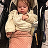 Charlotte joined the competition — help win amazing prizes! toddler, child, stroller, blanket, bottle, sleeping, cozy, pink, cream, jacket, hair_bow, indoors, floor, baby, resting, peaceful, cute, young_child, person, nap