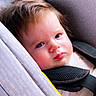 baby, blue_eyes, car_seat, child, closeup, clothing, comfort, expression, fabric, face, hair, indoors, infant, portrait, resting, seatbelt, sitting, skin, soft_light, young