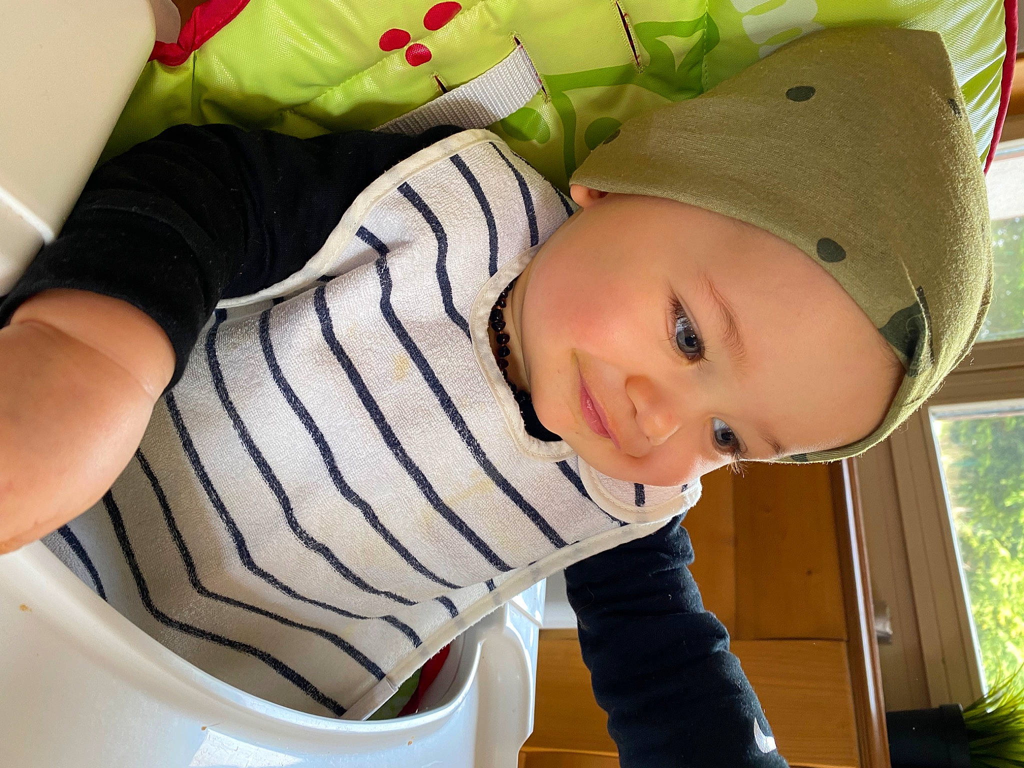 Malone participe au concours pour gagner de l'argent avec cette photo : baby, baby_products, baby_toddler_clothing, cap, cheek, child, comfort, elbow, grass, happy, hat, headwear, pattern, person, plant, sitting, sleeve, smile, sun_hat, t_shirt