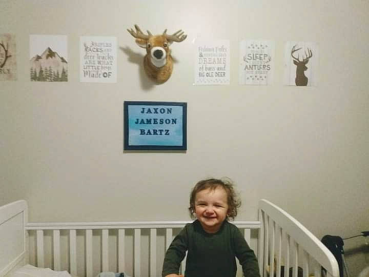 Jaxon is registered to the contest to win money with this photo: baby_toddler_clothing, comfort, event, font, gesture, happy, head, hoodie, joy, organ, person, room, sitting, smile, snapshot, t_shirt, toddler, visual_arts, white, yellow