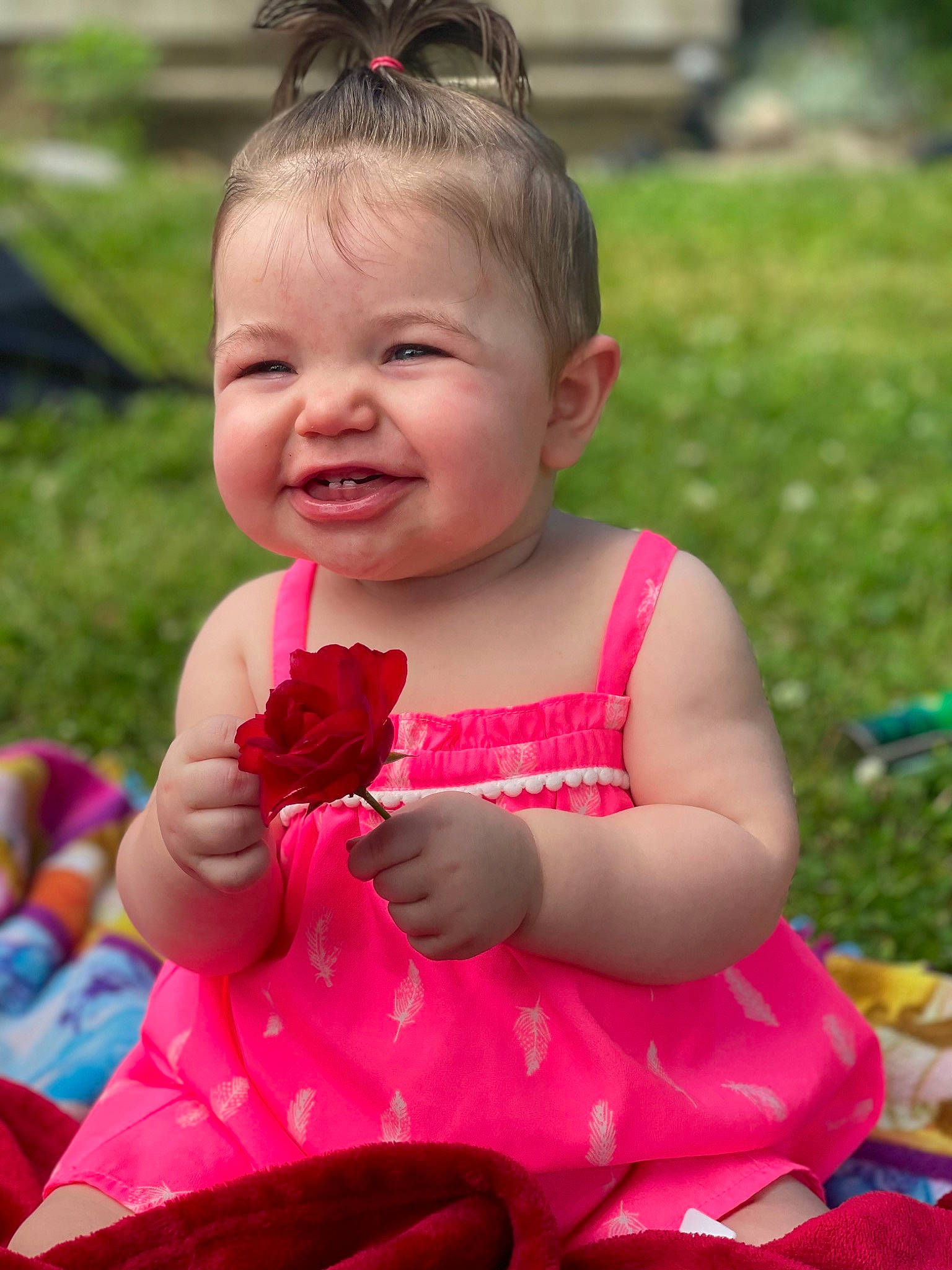Hopelynn is registered to the contest to win money with this photo: baby, baby_toddler_clothing, dress, eye, face, facial_expression, fun, grass, happy, head, human_body, leisure, lip, people_in_nature, person, pink, plant, skin, smile, summer