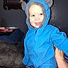 Joshua is registered to the contest to win money with this photo: toddler, child, blue_hoodie, smile, indoor, furniture, mirror, couch, table, person, happy, plush, clothing, face, hand, striped_pants, holding, cozy, wall, portrait