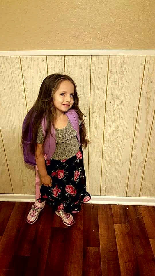 Alex joined the competition — help win amazing prizes! child, child_model, clothing, dress, floor, flooring, footwear, hardwood, joy, leggings, long_hair, pattern, person, pink, shoe, smile, standing, tights, toddler, waist