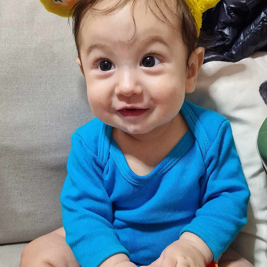 Leandro is registered to the contest to win money with this photo: baby, bodypart, clothing, couch, face, finger, footwear, furniture, glove, hand, happy, hat, head, hosiery, person, photography, portrait, shoe, shorts, sock