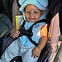 Tymir is registered to the contest to win money with this photo: baby, child, car_seat, blue_hoodie, smiling, tongue_out, safety_harness, sunlight, cute, infant, clothing, seatbelt, car_interior, happy, portrait, baby_hand, cozy, casual_wear, young_child, seat