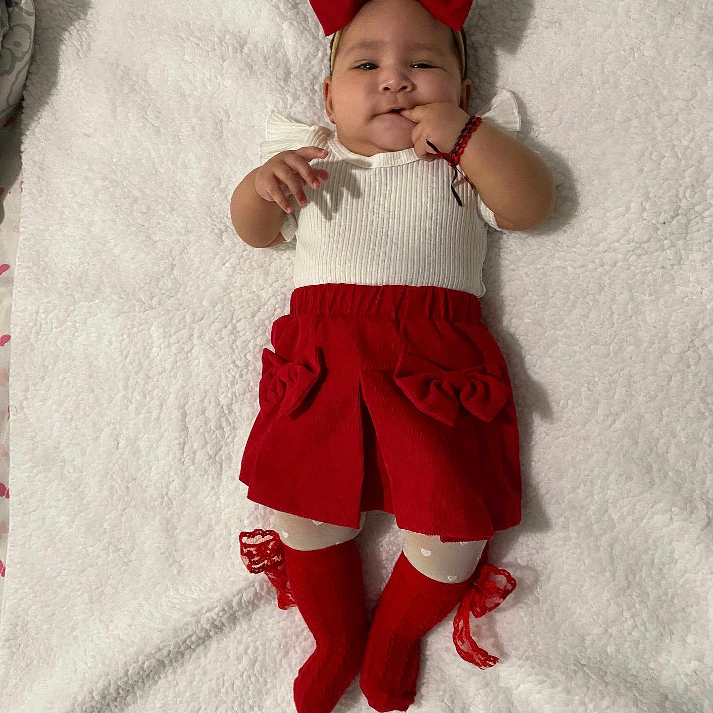 Noah is registered to the contest to win money with this photo: baby, blanket, bodypart, bonnet, cap, clothing, face, finger, footwear, hand, happy, hat, head, pants, person, photography, portrait, shorts, sitting, smile