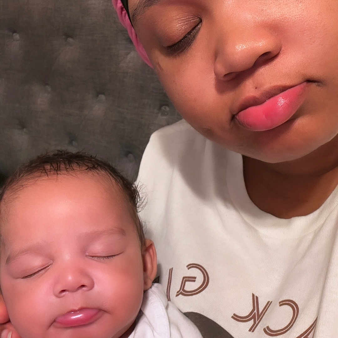 Chosyn is registered to the contest to win money with this photo: accessories, baby, bodypart, bonnet, cap, clothing, cosmetics, face, hat, head, headband, lipstick, mouth, newborn, people, person, photography, portrait, sleeping, t_shirt