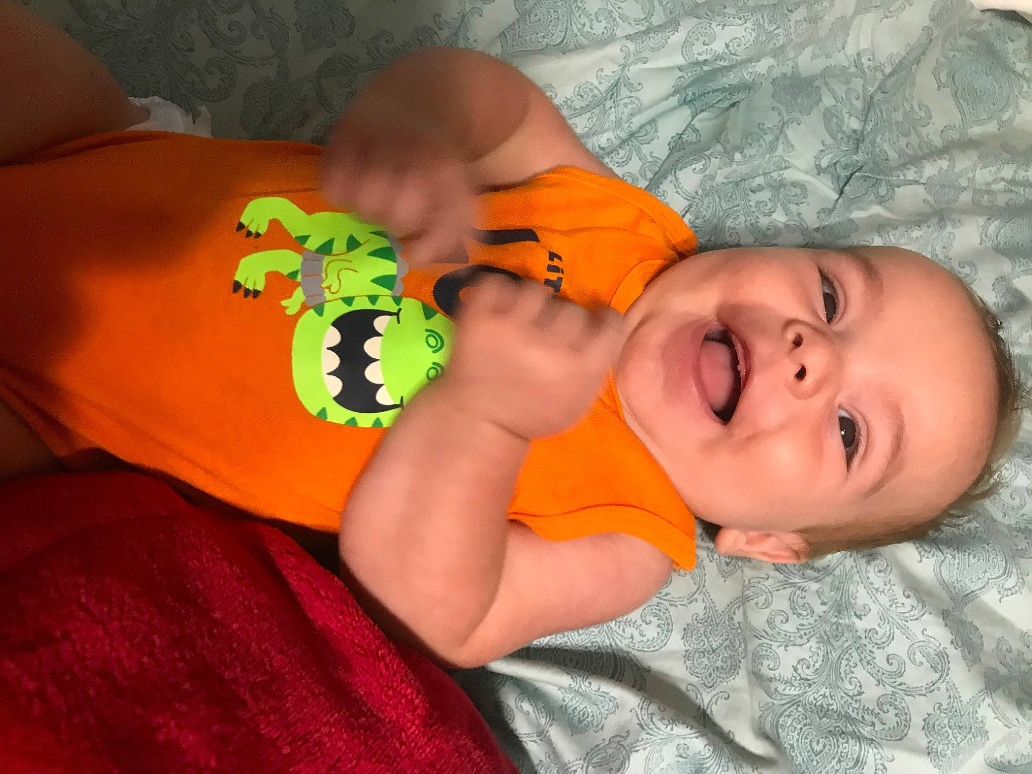 Kyzer is registered to the contest to win money with this photo: baby, bedtime, child, finger, fun, hand, head, mouth, nail, nose, orange, person, skin, toddler