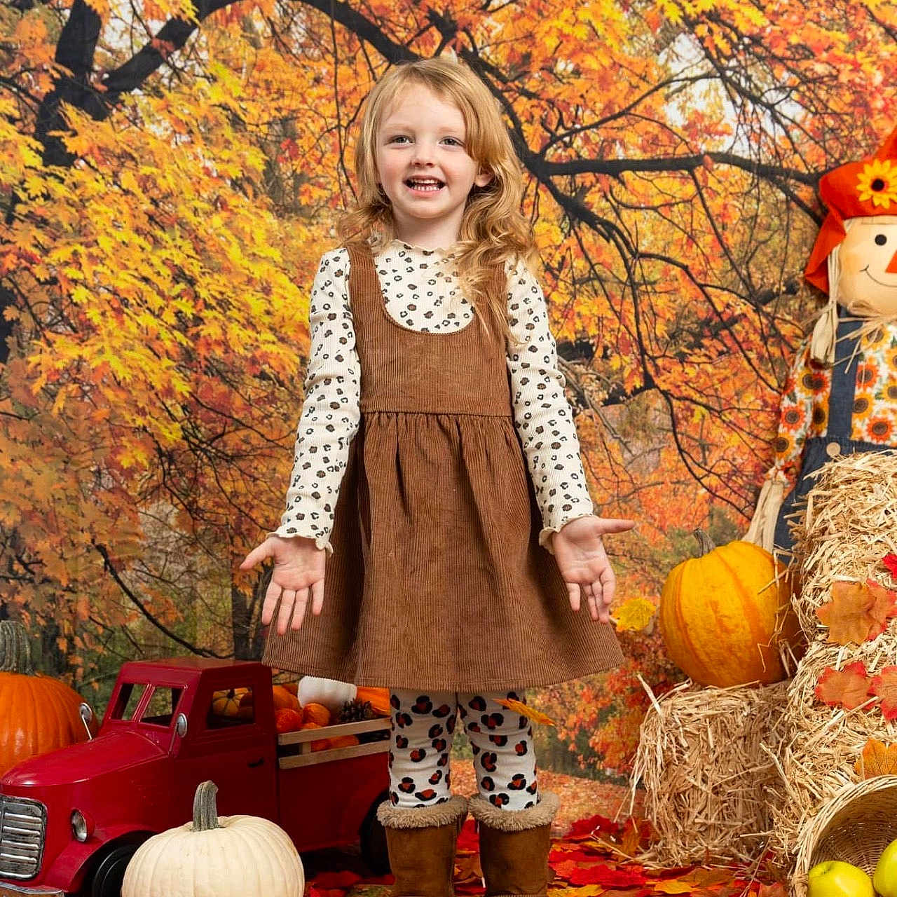 Kylie is registered to the contest to win money with this photo: autumn, child, clothing, coat, face, female, food, footwear, girl, head, leaf, person, photography, plant, portrait, produce, pumpkin, shoe, squash, vegetable