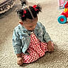 Aubree is registered to the contest to win money with this photo: toddler, child, girl, pigtails, red_bows, denim_jacket, checkered_dress, carpet, toy, bracelet, indoor, living_room, curious, sitting, cute, clothing, hair, earrings, floor, play