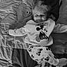 Maylo a rejoint le concours — aidez-le/la à gagner de superbes lots ! baby, blanket, child, clothing, comfort, cube, cute, face, happy, indoor, lying_down, mickey_mouse, monochrome, pajamas, person, playful, smiling, soft, toddler, toy
