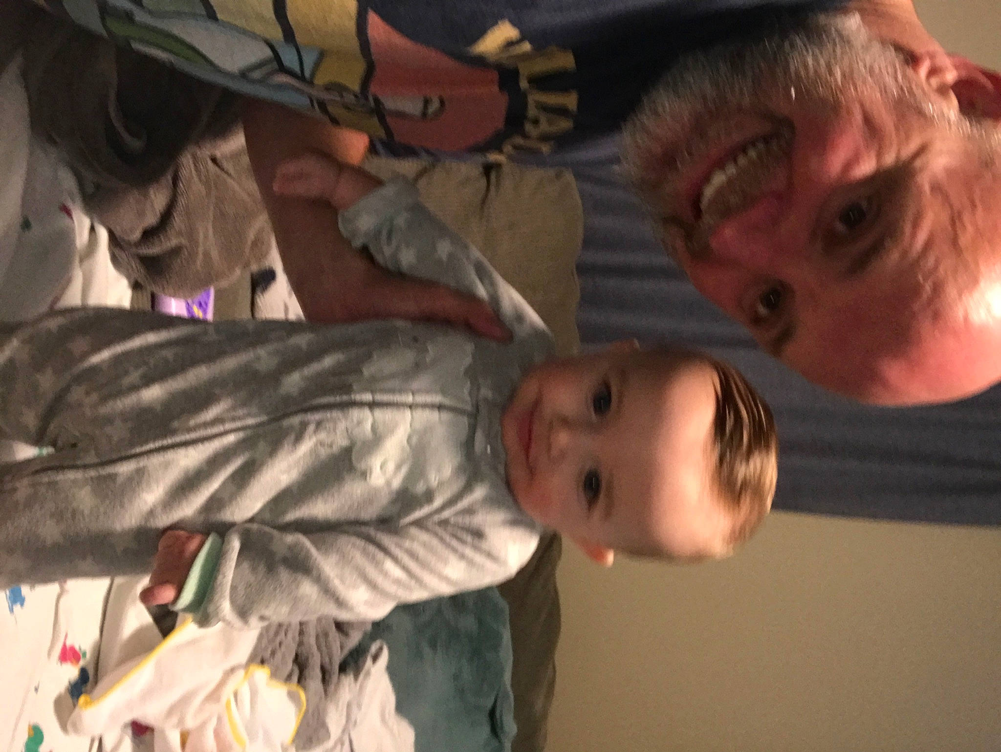 Jaxson is registered to the contest to win money with this photo: baby, cheek, child, event, flash_photography, forehead, fun, gesture, happy, human_body, joy, mouth, nose, organ, person, room, smile, toddler