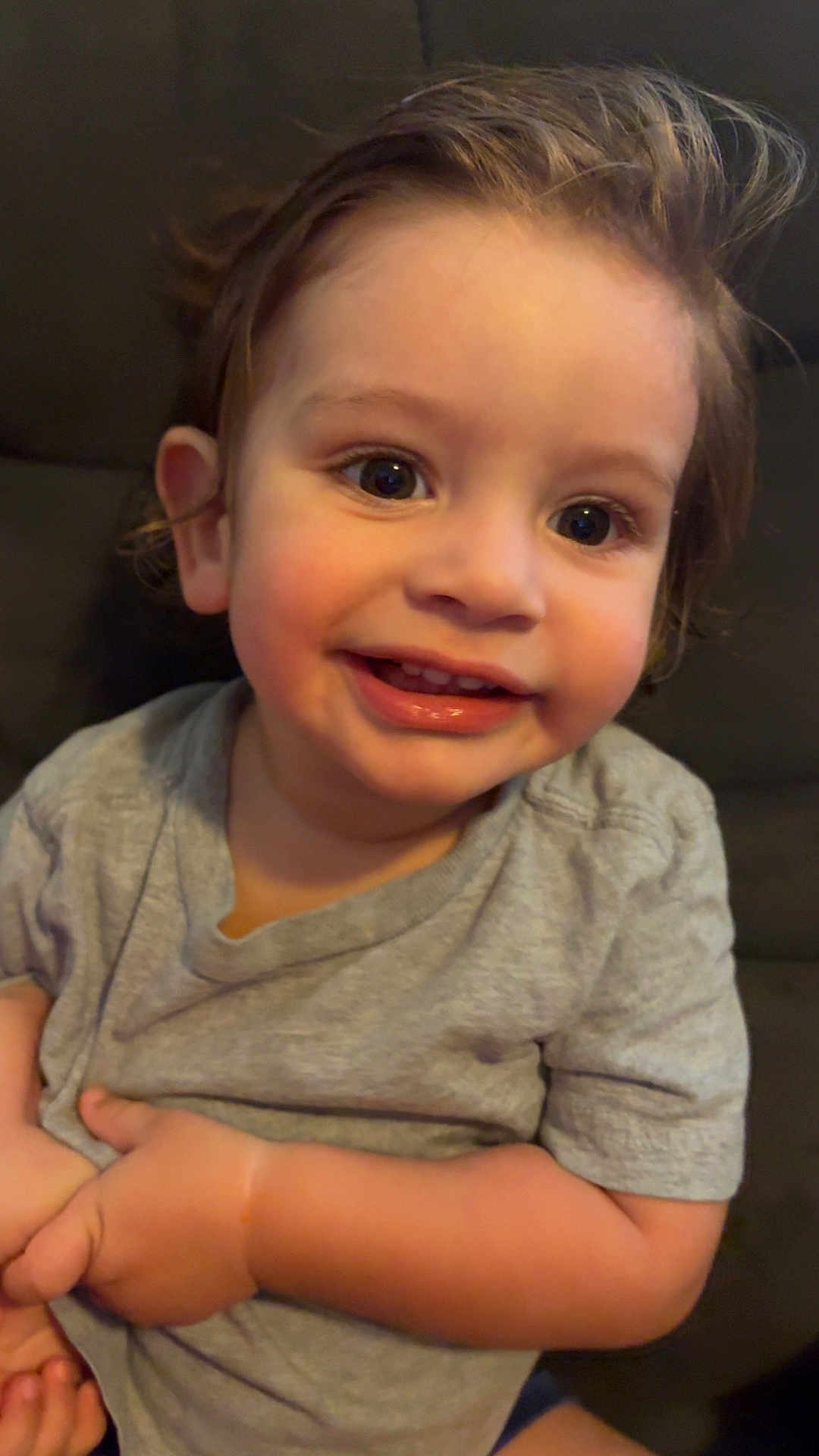 Theo joined the competition — help win amazing prizes! child, toddler, smile, happy, face, eyes, hair, gray_shirt, sitting, indoors, cute, person, portrait, skin, hand, young, baby, expression, casual, closeup