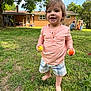 Theo joined the competition — help win amazing prizes! toddler, child, grass, outdoor, barefoot, eggs, playset, house, tree, sunny, smiling, person, daytime, greenery, casual_clothing, shorts, shirt, family, backyard, nature