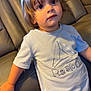 Theo joined the competition — help win amazing prizes! toddler, child, indoor, couch, leather, tshirt, clothing, shorts, person, face, hair, curious, young, leaning, hand, furniture, home, expression, casual, portrait