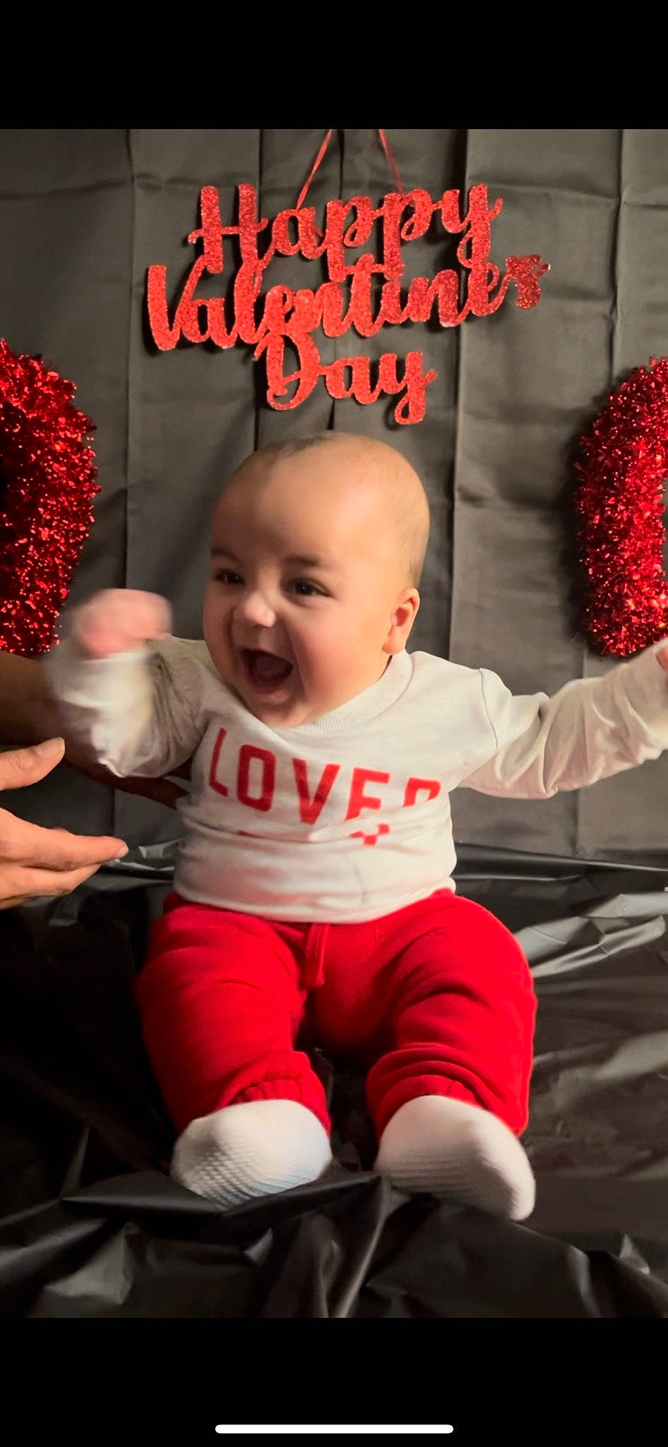 Arthur is registered to the contest to win money with this photo: baby, baby_laughing, baby_toddler_clothing, beauty, chair, cheek, child, gesture, hairstyle, happy, human, leg, mouth, organ, person, pink, red, smile, snapshot, t_shirt
