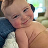 Cassius is registered to the contest to win money with this photo: baby, smile, face, cheeks, skin, child, infant, cushion, denim, indoors, soft_light, happy, closeup, portrait, cute, expression, relaxed, head, shoulders, bare_skin