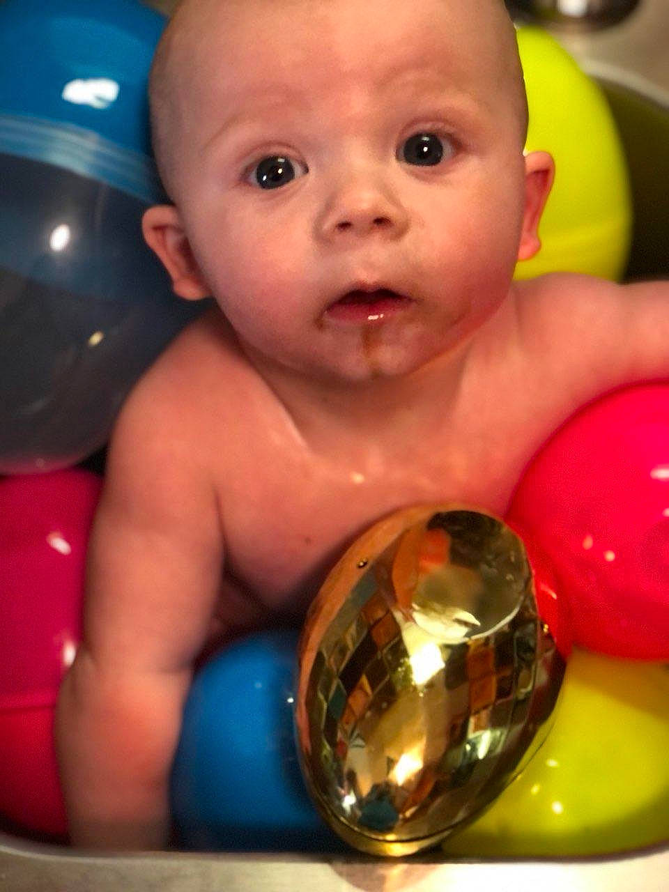 Cylis is registered to the contest to win money with this photo: abdomen, arm, baby, ball, bathing, beauty, cheek, chest, eyebrow, eyelash, finger, fun, hand, iris, mouth, nose, organ, person, skin, surprise