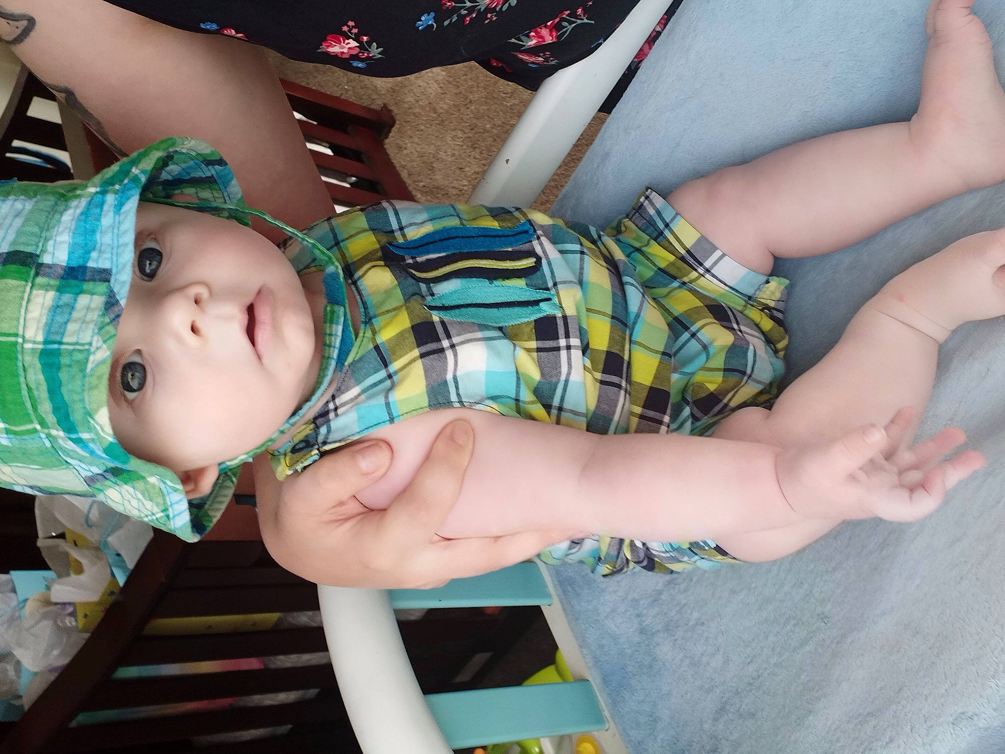 Cylis is registered to the contest to win money with this photo: baby, baby_products, baby_toddler_clothing, child, clothing, dress, facial_expression, finger, headwear, human_body, human_leg, leg, nail, pattern, person, plaid, skin, tartan, thigh, toddler