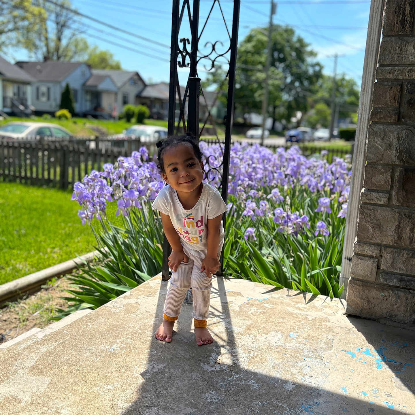 Alaia Rose is registered to the contest to win money with this photo: barefoot, blue_sky, casual_clothing, child, daylight, fence, flowers, garden, grass, greenery, happy, house, nature, outdoor, person, playful, porch, smiling, suburban, sunlight