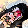 Naomi joined the competition — help win amazing prizes! accessory, baby, blanket, car_seat, child, clothing, cozy, cute, headwear, indoors, infant, leopard_print, newborn, pink, red_bow, resting, safety_harness, sleeping, soft_texture, white