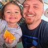 Nadiyah Claire is registered to the contest to win money with this photo: toddler, child, man, smile, orange_slice, food, dining_table, chair, cap, beard, happy, person, indoor, plate, clothing, table, face, family, casual, portrait