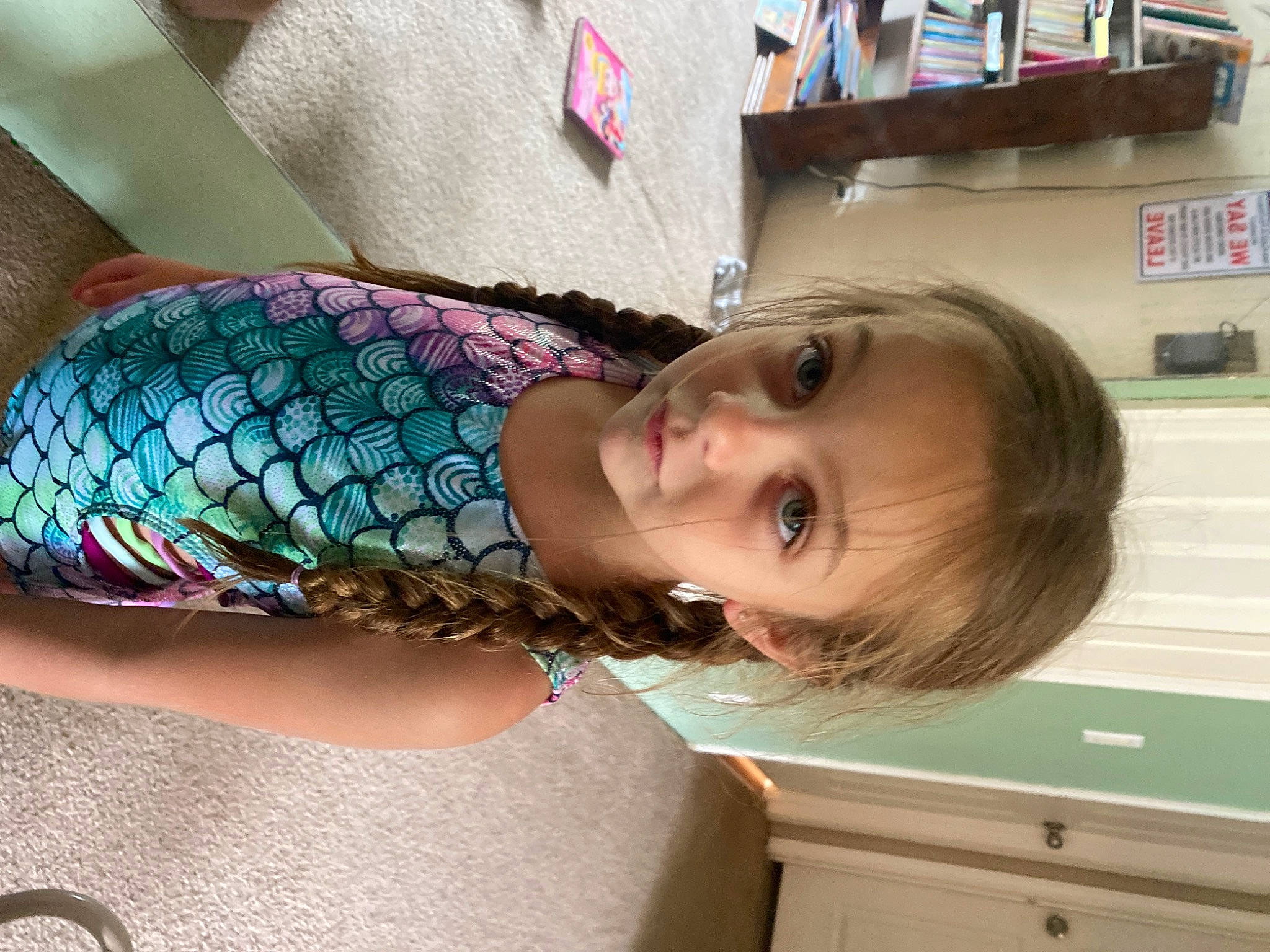 Addison is registered to the contest to win money with this photo: cabinetry, child, couch, drawer, eye, fashion_accessory, human_leg, pattern, peafowl, person, room, shelf, shoulder, sitting, smile, tattoo, thigh, toddler, wood