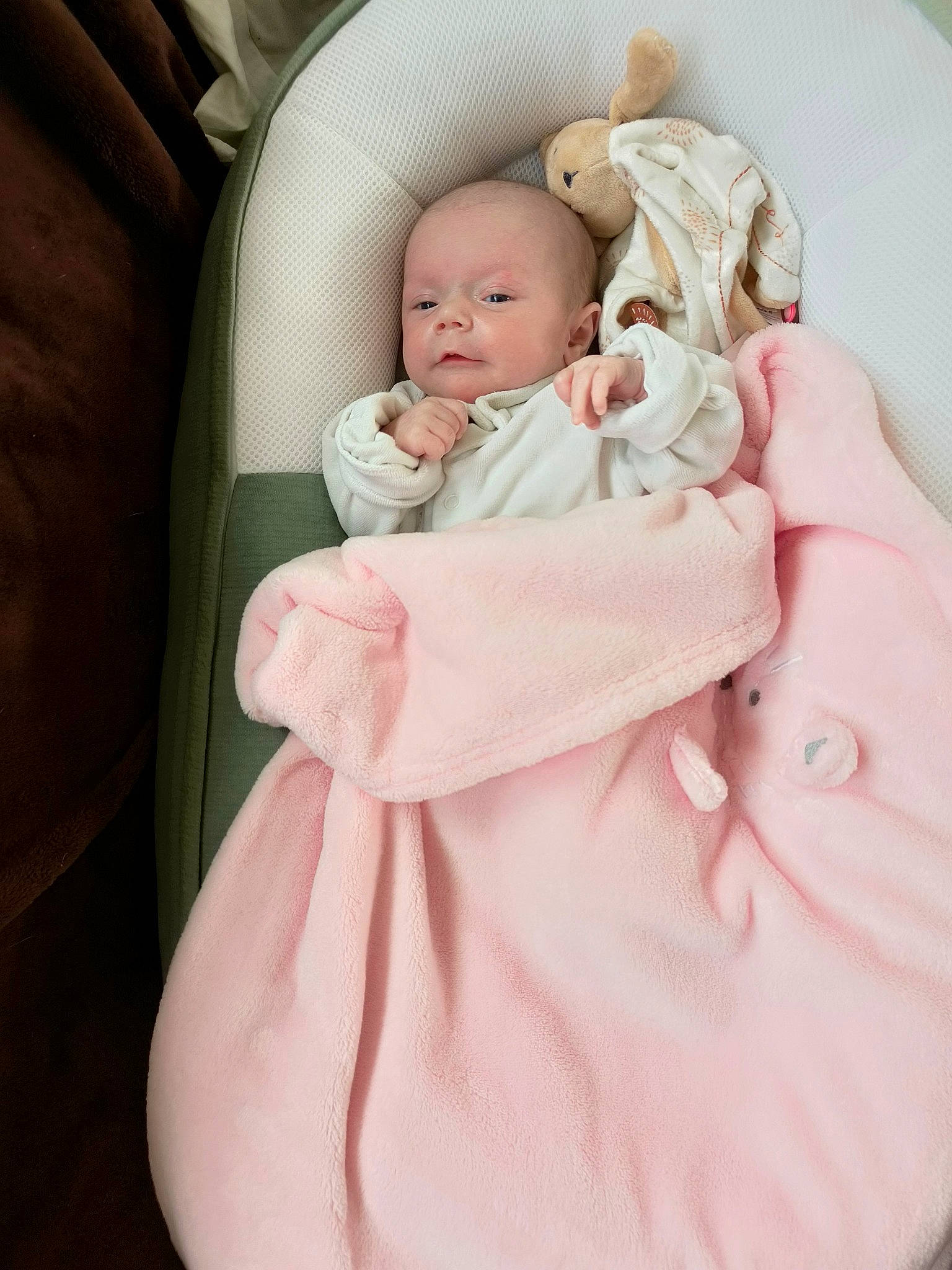 Azzurra participe au concours pour gagner de l'argent avec cette photo : baby, baby_products, baby_safety, baby_sleeping, baby_toddler_clothing, bedding, cheek, child, comfort, dress, human_body, infant_bed, linens, peach, person, pink, room, sitting, skin, sleeve