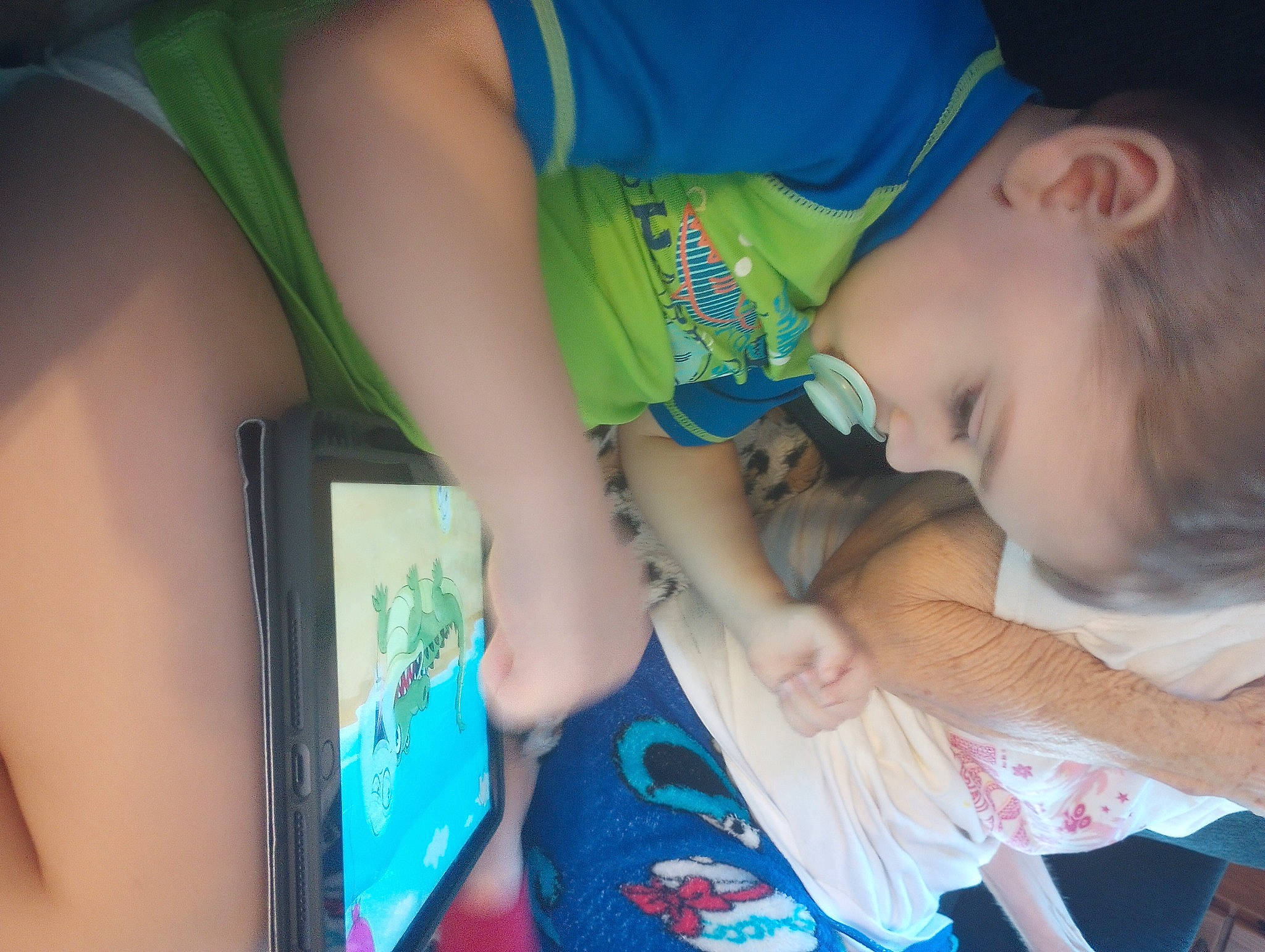 Jj is registered to the contest to win money with this photo: baby_toddler_clothing, elbow, electric_blue, finger, fun, gadget, gesture, happy, human, human_leg, joint, leisure, mouth, nail, person, sitting, t_shirt, thigh, thumb, toddler