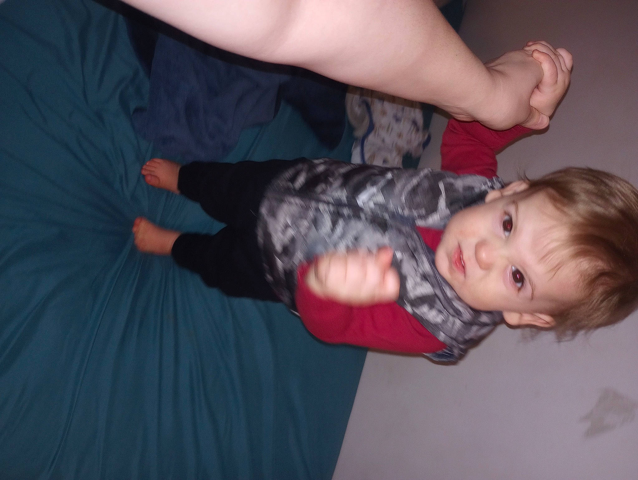 Michael is registered to the contest to win money with this photo: arm, baby_toddler_clothing, elbow, finger, flash_photography, fun, gesture, hand, head, human_body, human_leg, joint, knee, leg, mouth, nail, person, sleeve, thumb, toddler