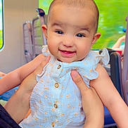 Ayat joined the competition — help win amazing prizes! baby, child, clothing, cute, dress, face, hands, happy, head, holding, indoor, infant, person, seat, seatback, skin, smiling, train, transportation, window