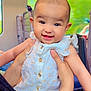baby, child, clothing, cute, dress, face, hands, happy, head, holding, indoor, infant, person, seat, seatback, skin, smiling, train, transportation, window