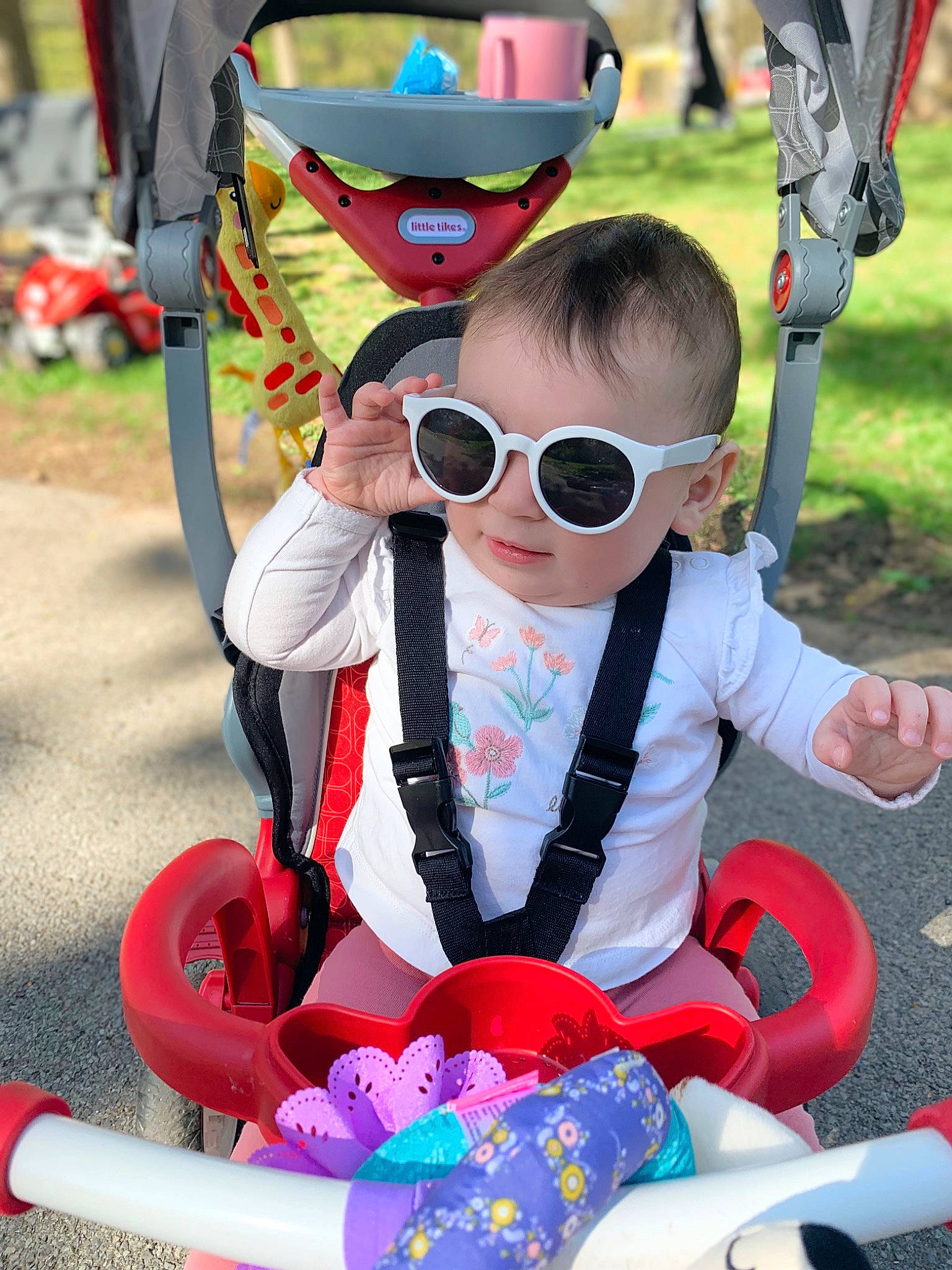 Eloise joined the competition — help win amazing prizes! baby, baby_carriage, baby_products, blue, eyewear, fun, goggles, green, leisure, person, personal_protective_equipment, plant, recreation, red, snapshot, summer, sunglasses, toddler, vision_care, white