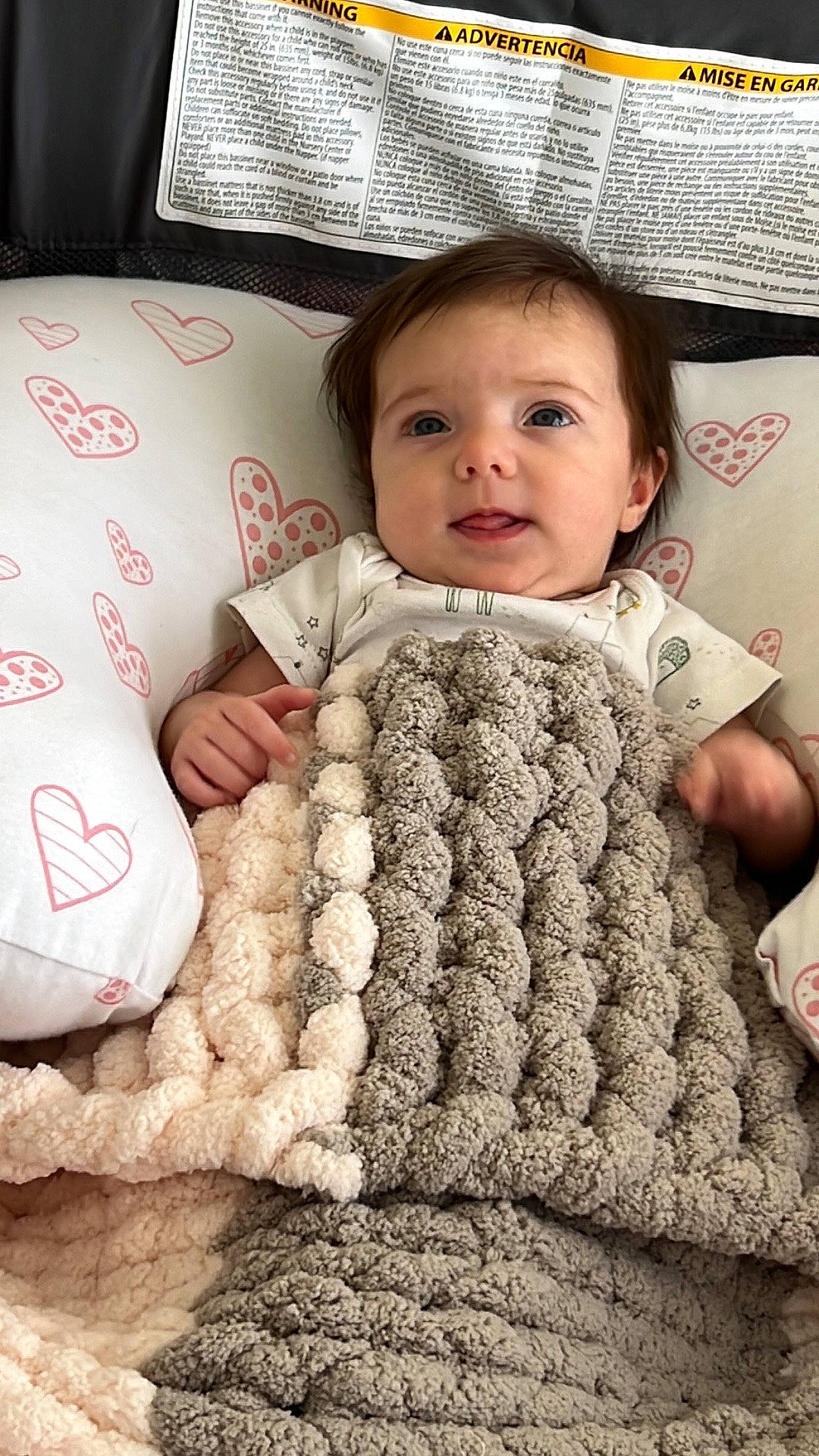 Eryn joined the competition — help win amazing prizes! baby, baby_toddler_clothing, cheek, comfort, eye, face, finger, flooring, gesture, headgear, linens, nail, person, skin, sleeve, smile, textile, thumb, toddler, white