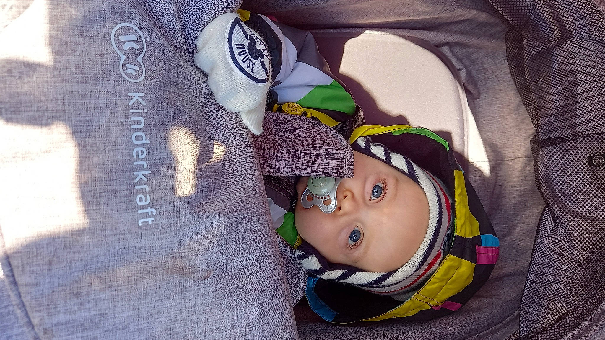 Swan participe au concours pour gagner de l'argent avec cette photo : baby, baby_carriage, baby_products, baby_toddler_clothing, cheek, child, comfort, fashion_accessory, font, happy, hat, headgear, headwear, linens, outerwear, pattern, person, textile, toddler, wood