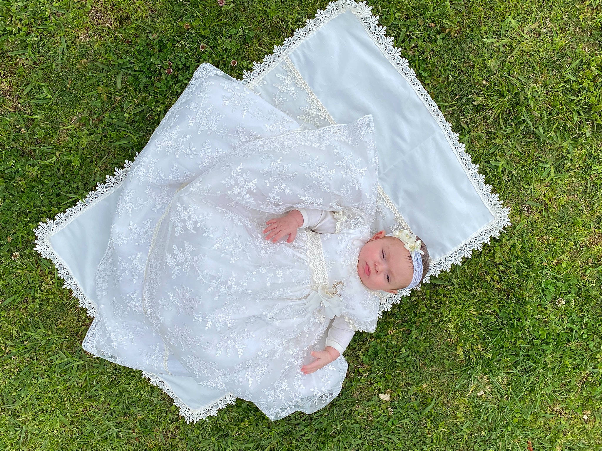 Annabeth joined the competition — help win amazing prizes! baby, baby_toddler_clothing, bridal_accessory, dress, event, gesture, grass, grass_family, grassland, hand, happy, head, headwear, human_body, lawn, meadow, people_in_nature, person, petal, plant