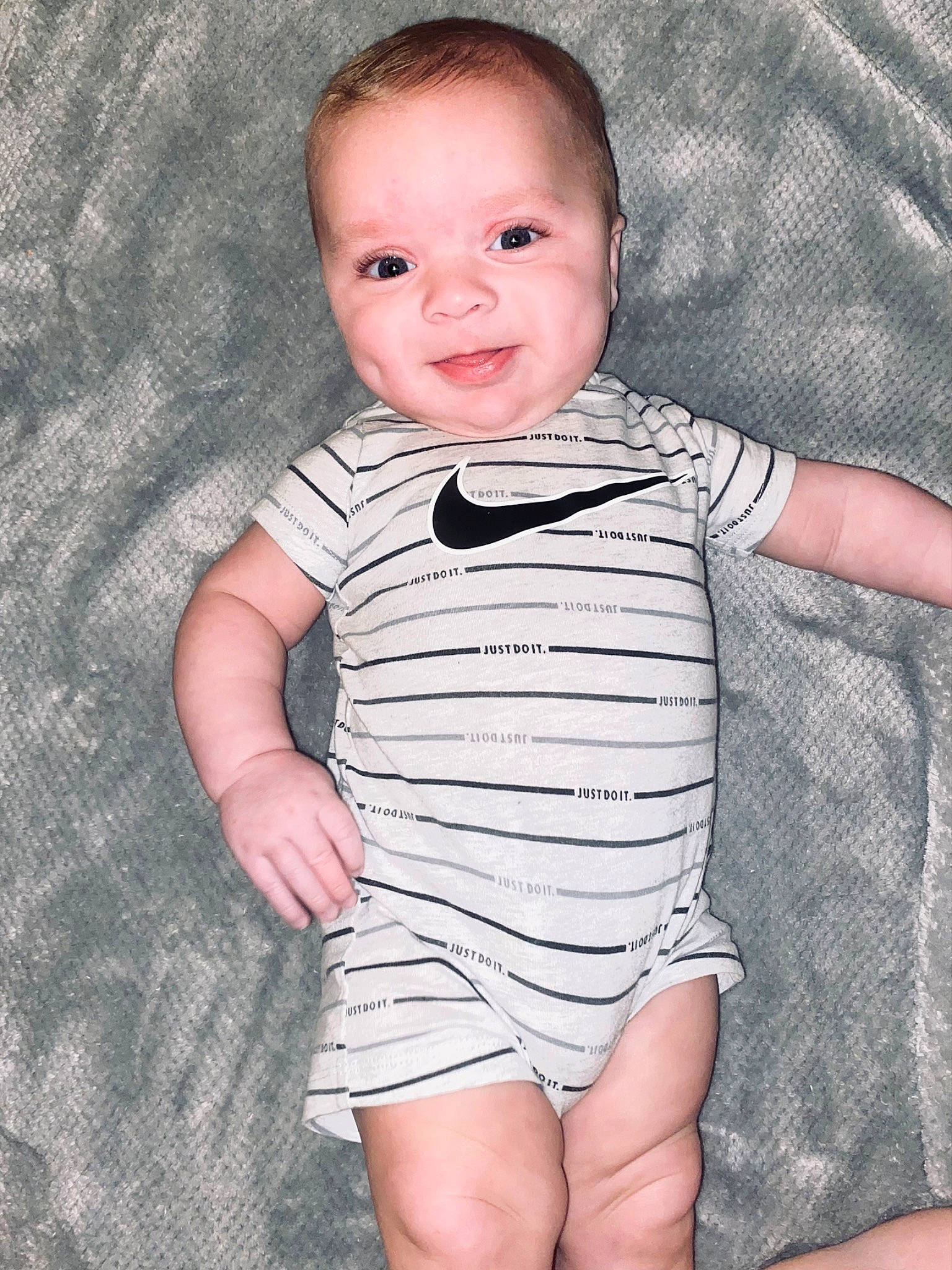 Kashtin is registered to the contest to win money with this photo: baby, baby_toddler_clothing, cheek, child, collar, eye, face, finger, gesture, happy, head, neck, pattern, person, product, skin, sleeve, smile, standing, textile