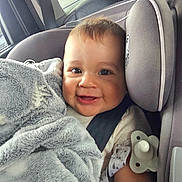 Zarek joined the competition — help win amazing prizes! baby, car_seat, blanket, pacifier, smile, happy, child, infant, seatbelt, window, car_interior, clothing, face, head, person, cute, fuzzy, comfort, travel, safe