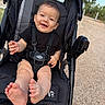 Maclovio joined the competition — help win amazing prizes! baby, bare_feet, black_clothing, child, daylight, face, hands, happy, harness, infant, legs, outdoor, park, path, photography, portrait, road, seated, smiling, stroller