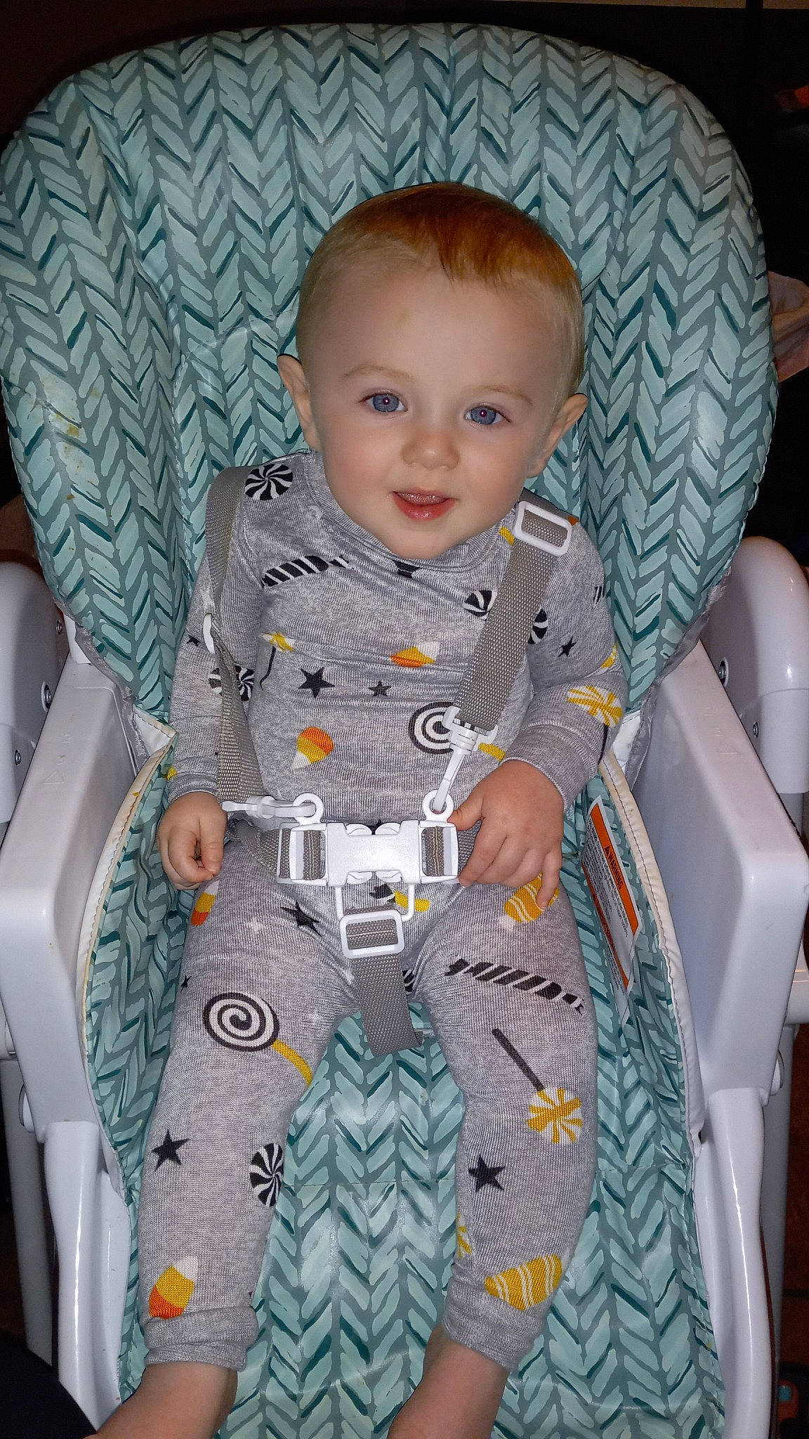 Gage is registered to the contest to win money with this photo: baby, baby_products, baby_toddler_clothing, blond, chair, cheek, child, comfort, face, fun, iris, linens, pattern, person, product, sitting, sleeve, smile, t_shirt, textile