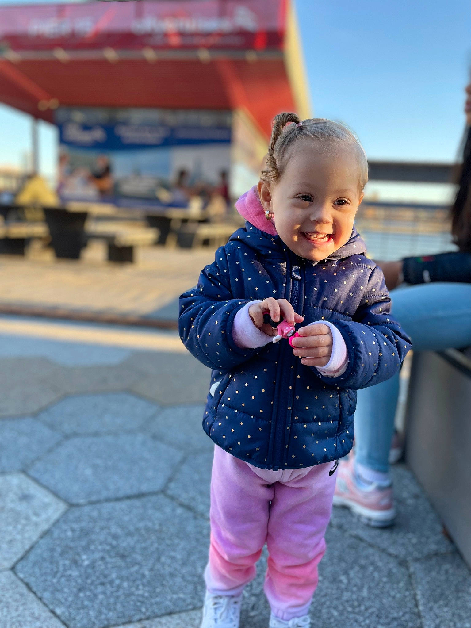 Kaylie joined the competition — help win amazing prizes! baby, baby_toddler_clothing, child, city, electric_blue, facial_expression, flooring, fun, hairstyle, happy, joy, leisure, pattern, person, recreation, skin, sky, sleeve, smile, toddler