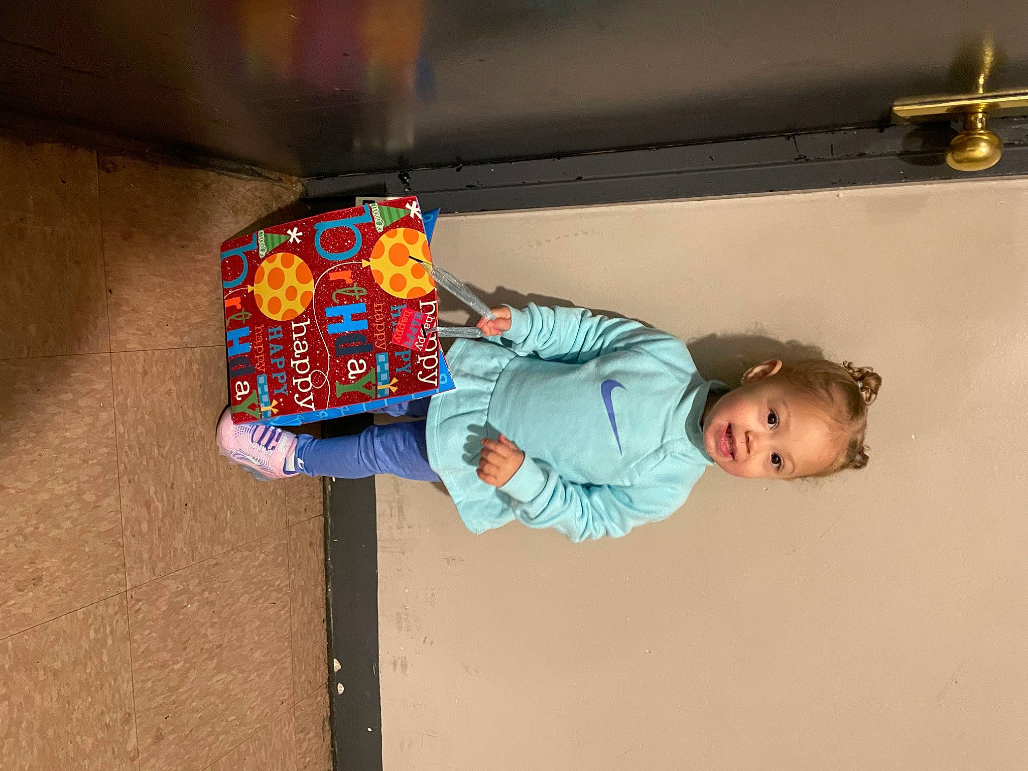 Kaylie is registered to the contest to win money with this photo: baby_toddler_clothing, ceiling, child, door, fun, happy, leisure, person, play, room, t_shirt, toddler, travel