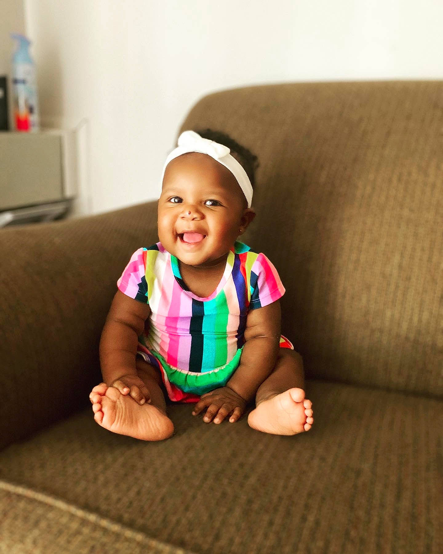 Lillyana joined the competition — help win amazing prizes! baby, baby_toddler_clothing, cheek, child, comfort, couch, face, flooring, fun, grass, happy, head, human_leg, joy, person, sitting, skin, sleeve, smile, t_shirt