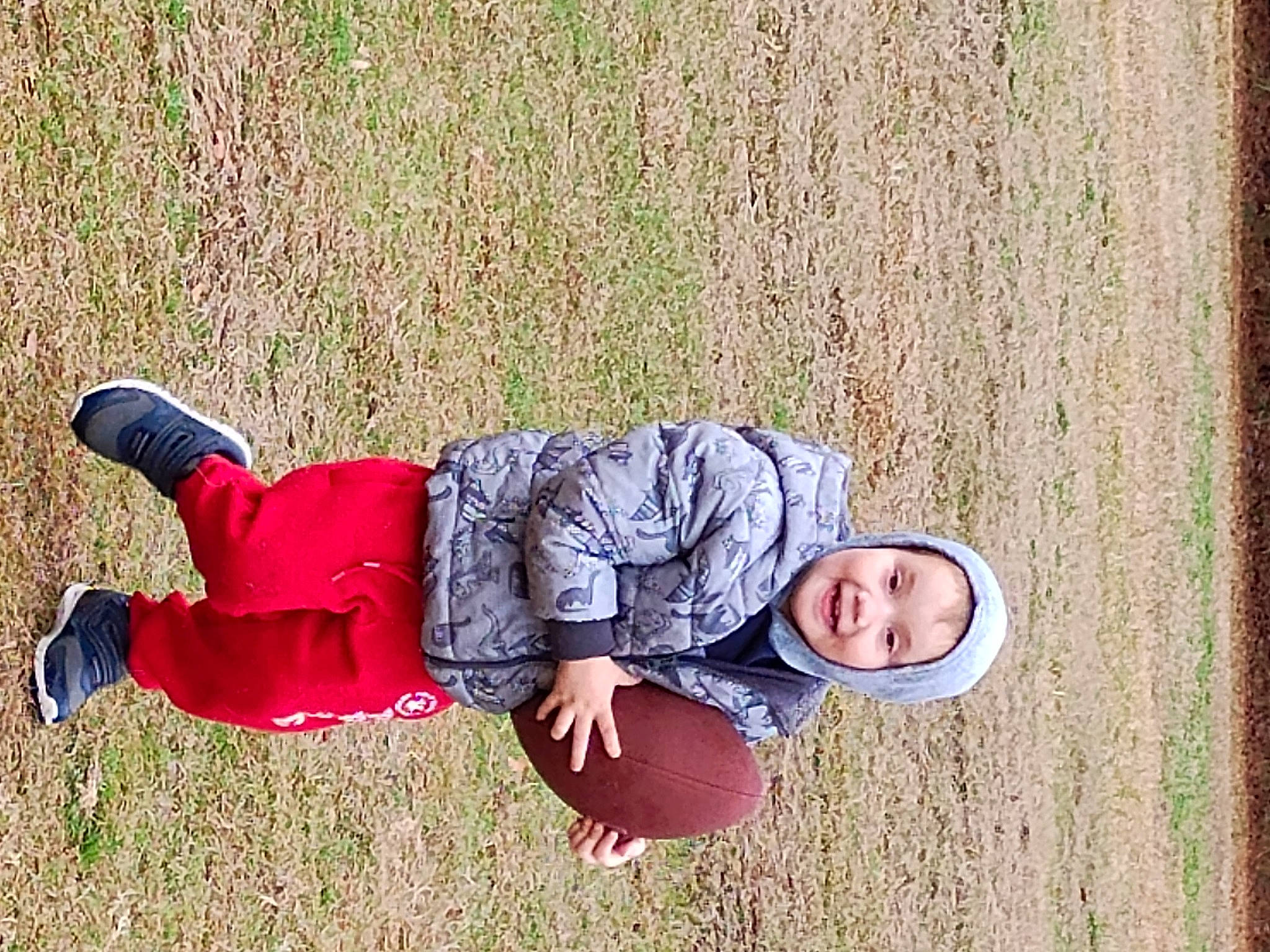 Kamarie joined the competition — help win amazing prizes! baby, baby_toddler_clothing, carmine, child, fun, grass, happy, headwear, human_leg, joy, knee, leisure, people_in_nature, person, plant, recreation, sitting, smile, sneakers, toddler